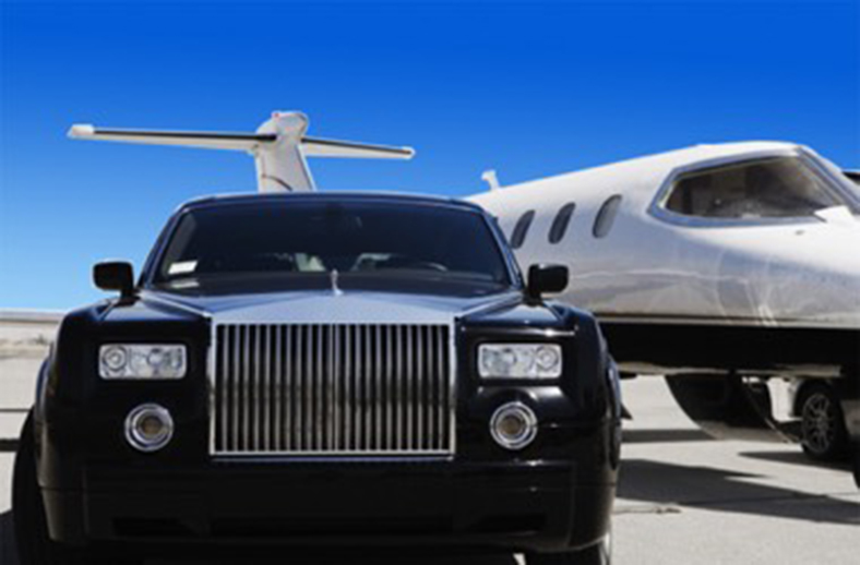 a limo next to a private jet